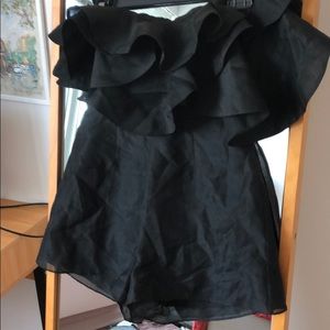 Black sleeveless romper with ruffles